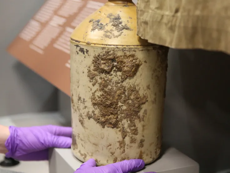 Installing a First World War rum jar in the Conflict in Europe gallery