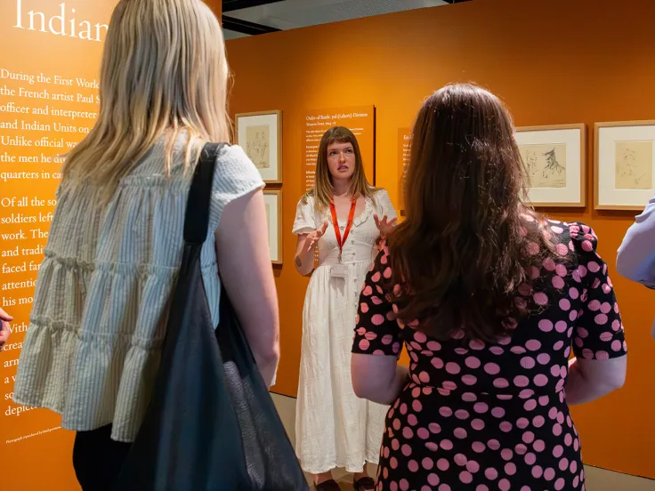 Visitors attending an exhibition tour
