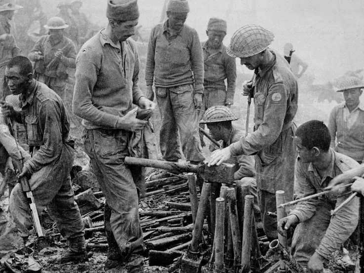 Indian and Gurkha soldiers inspect captured Japanese ordnance, Burma campaign, 1944
