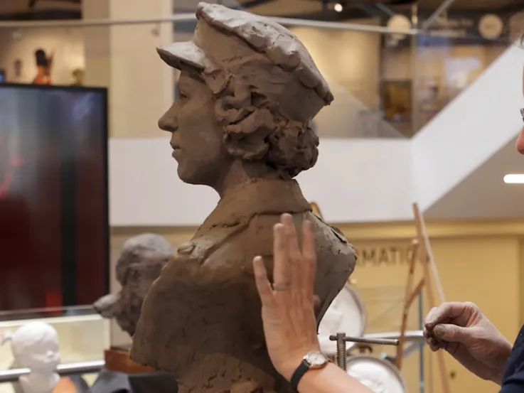 Keziah Burt sculpting a portrait bust of HM Queen Elizabeth II