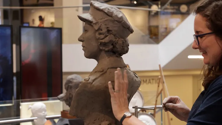 Keziah Burt sculpting a portrait bust of HM Queen Elizabeth II