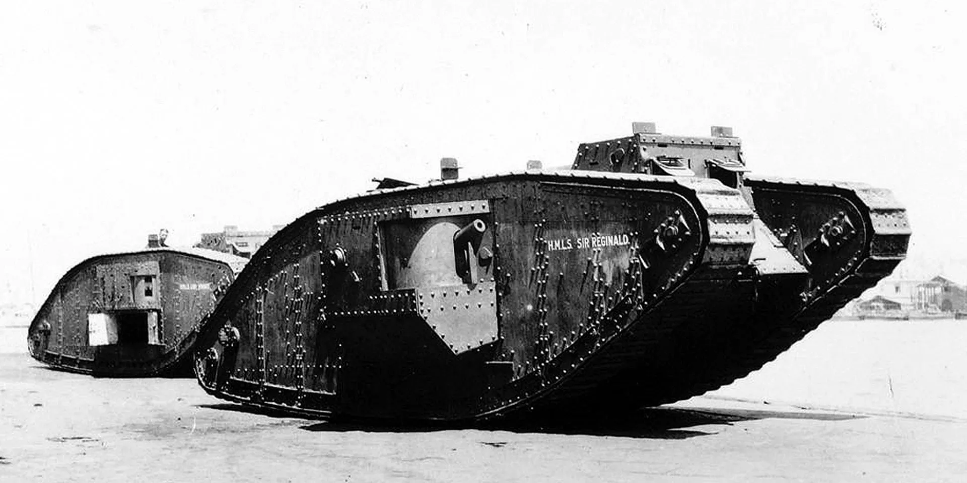 A ‘female' Mark IV (left) armed with machine guns and a 'male' armed with both the latter and two six pounder guns, c1917