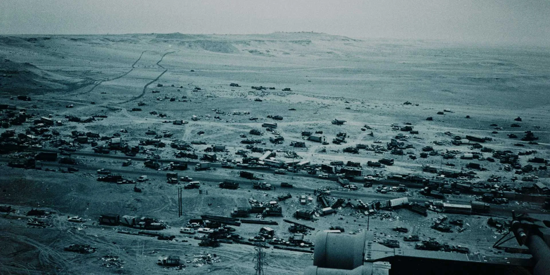 Wrecked military and civilian vehicles on the Basra road, 1991