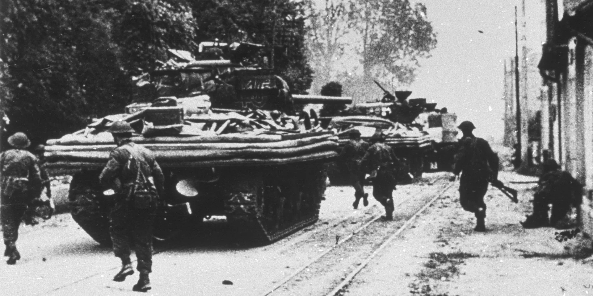 Amphibious tanks of 13th/18th Royal Hussars moving through Ouistreham, Normandy, 6 June 1944