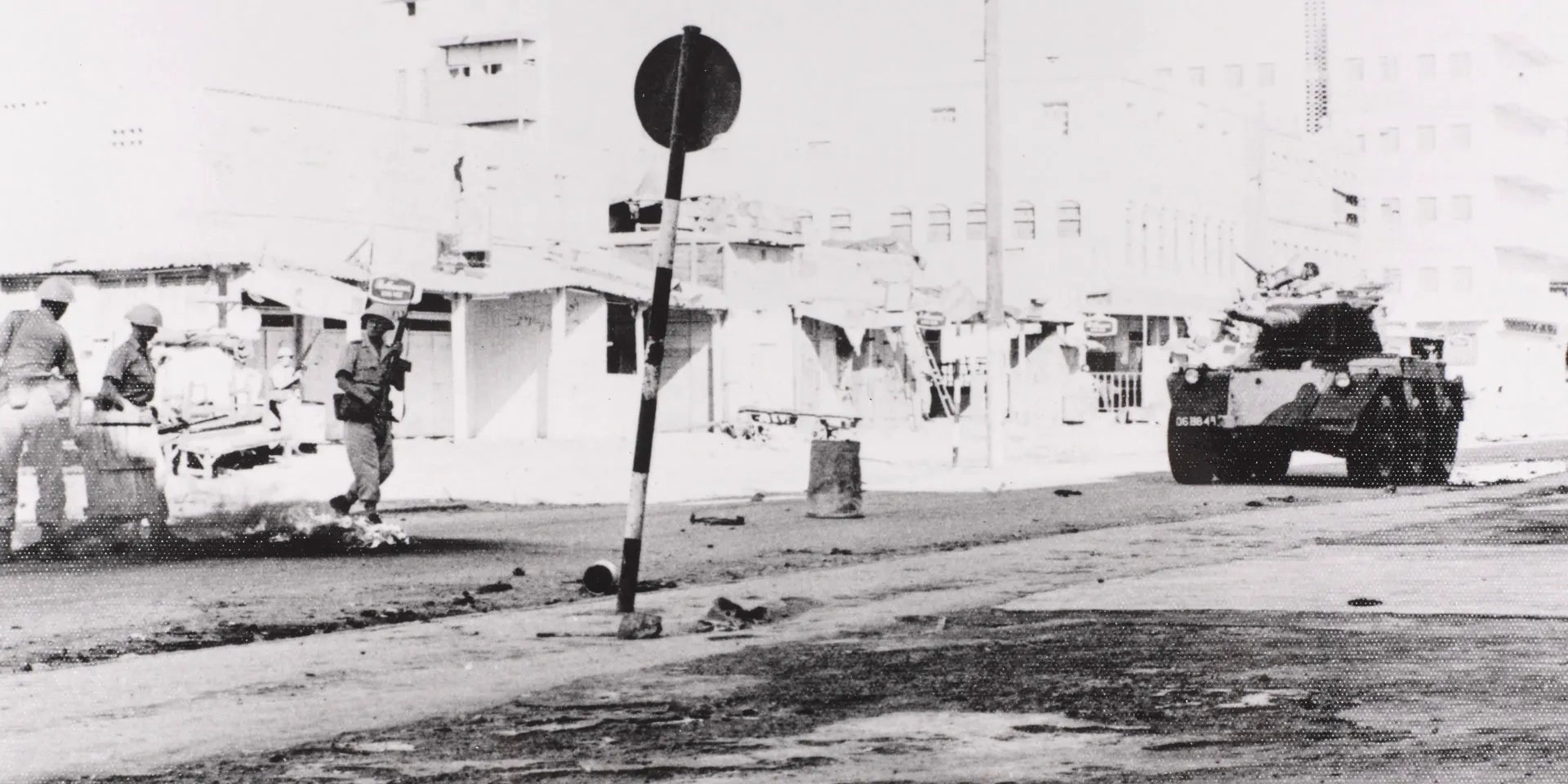 A Saladin armoured car patrols the Aden streets during a riot, 1967