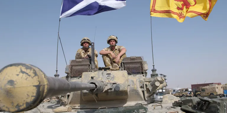 Black Watch Warrior armoured vehicle flying Scottish flags, Iraq, October, 2004