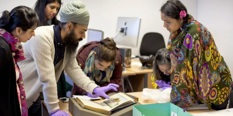 Workshop participants explore collection items