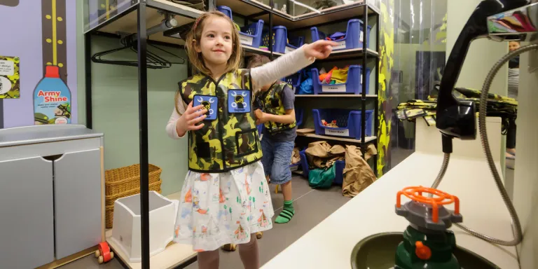 A child in the Play Base quatermaster store