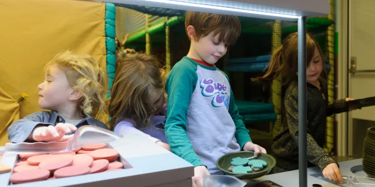 Children in the Play Base cookhouse