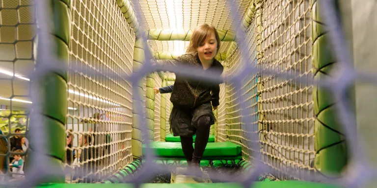 A child on the Play Base assault course