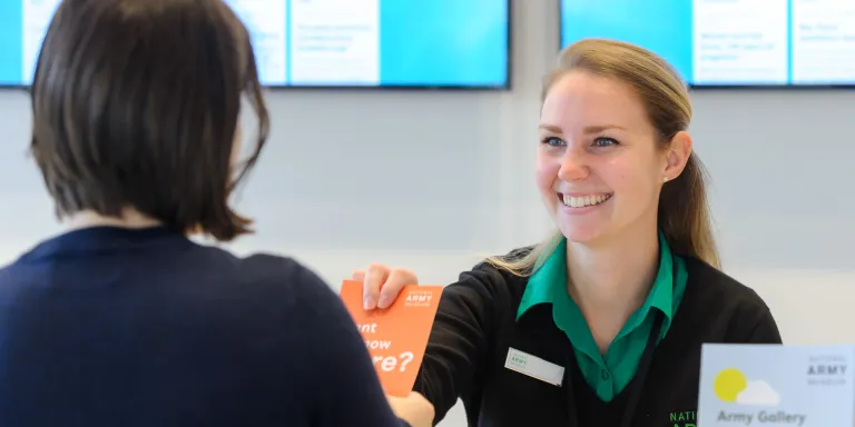 A visitor being greeted by a member of staff.