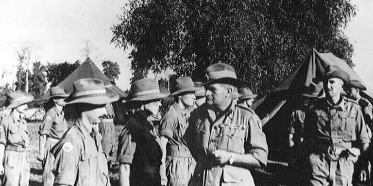 Lieutenant-General Sir William Slim (second right) meets members of 11th (East African) Division in Burma, 1945