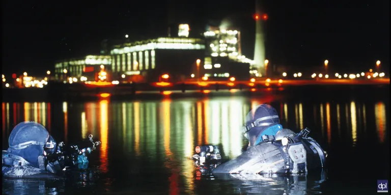 Swimmer canoeist divers pictured during a night-time exercise, c2000