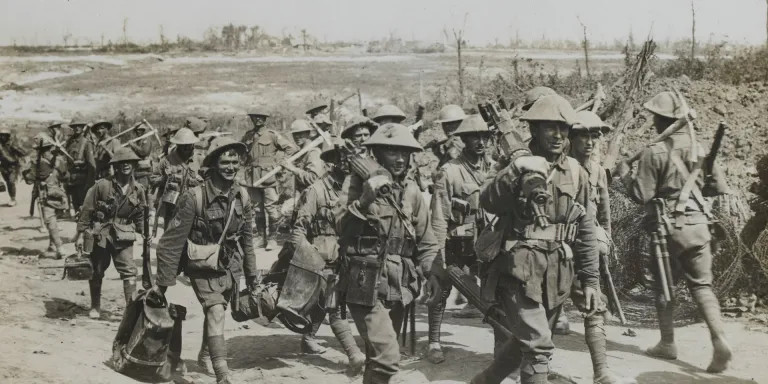 Australian machine gun team passing a working party, 1916