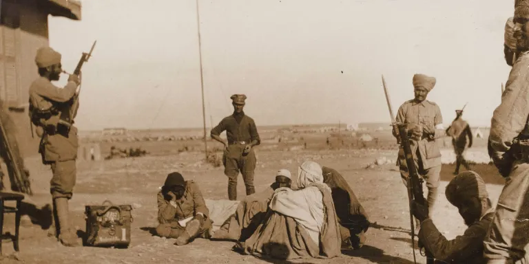 Indian Army soldiers stand guard over wounded Bedouin at Mersa Matruh, 1915