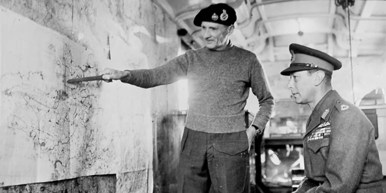 Montgomery explaining his plans to King George VI inside Monty’s map caravan in 1944