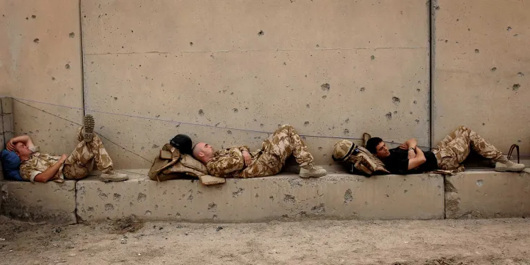 Troops from 1st Battalion The Staffordshire Regiment rest after a patrol in Basra, 2007