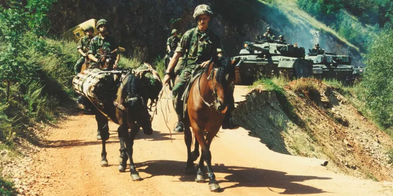 King's Royal Hussars on mounted patrol alongside their Challenger tanks, Mrkonjic Grad, Bosnia, 1997