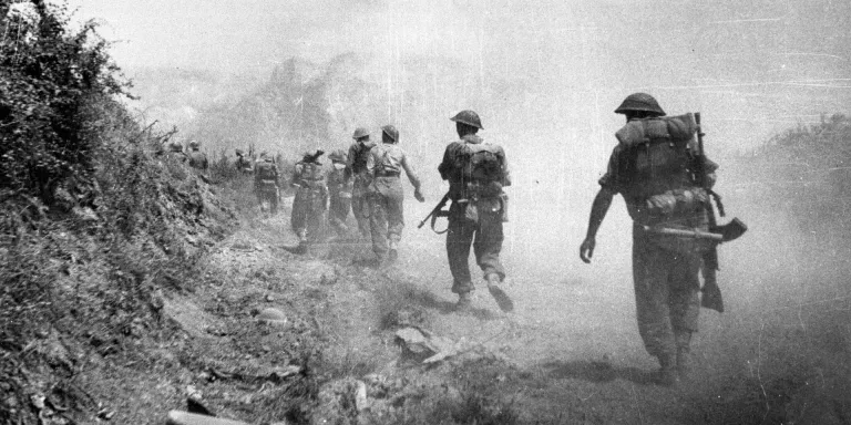 British troops moving through a smoke screen past Monastery Hill into Cassino, Italy, 1944