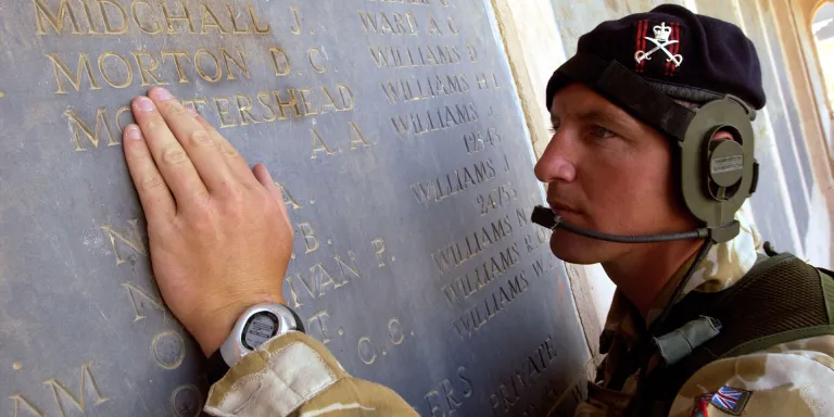 A sergeant of the Army Physical Training Corps, finds his namesake amongst the list of the fallen from the Mesopotamia campaign during World War One, July 2004