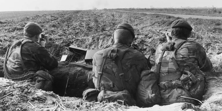 British soldiers dug-in by the side of a road during an exercise in West Germany, 1979