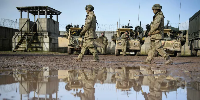 Reconnaissance platoon of 1st Battalion The Royal Welsh move through camp prior to a patrol exercise on Salisbury Plain, 2017 