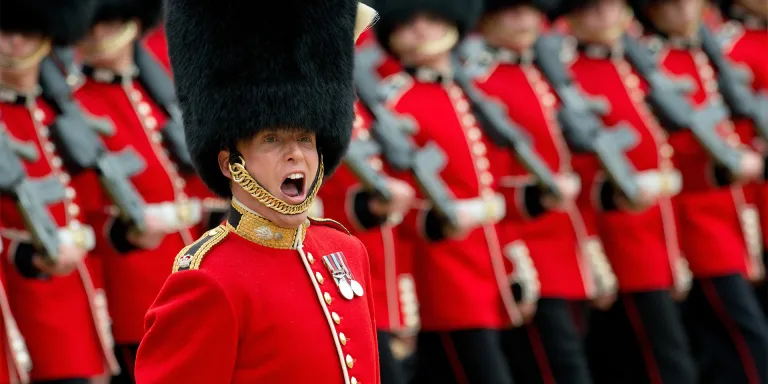 An officer of the Grenadier Guards gives an order on the march at Horse Guards Parade, London, 2015